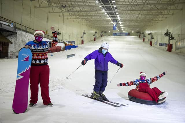 Staff Sean Myles and Natilia King welcomed back the 94 year-old pro skier, Enrico Zanotti who is described as 'slick' and 'smooth' on the slopes (photo: Jeff Holmes).