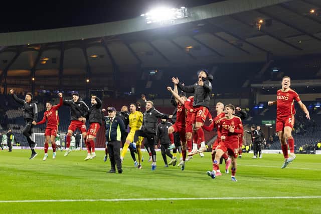 Aberdeen players celebrate beating Hibs to reach the Viaplay Cup final.