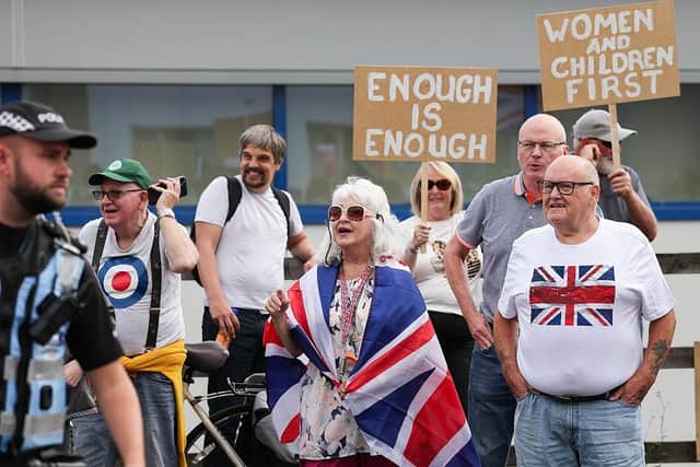 Protesters demonstrate against uncontrolled immigration outside the Cladhan Hotel, Falkirk, this month (Picture: Jeff J Mitchell/Getty Images)
