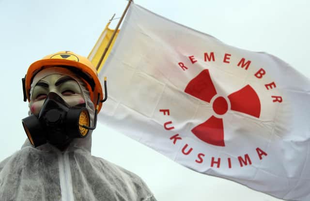 A protester makes a point outside the Hinkley Point nuclear power station on the anniversary of the Fukushima disaster in Japan (Picture: Matt Cardy/Getty Images)