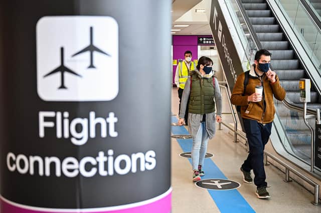 Passengers make their way through the main terminal at Edinburgh Airport last week. (Photo by Jeff J Mitchell/Getty Images)