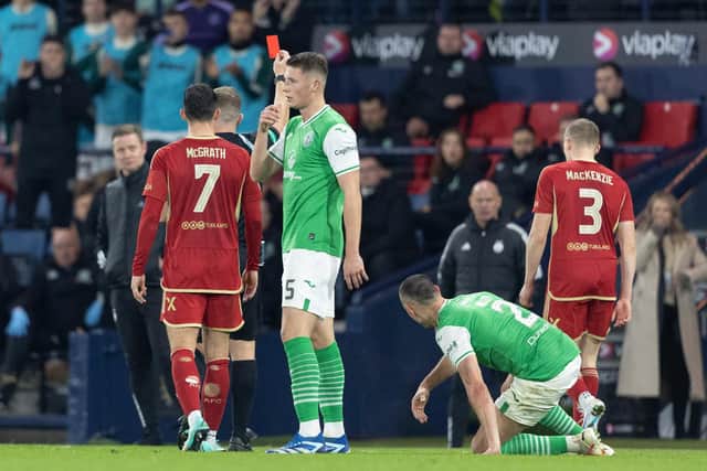 Aberdeen’s Jack MacKenzie was sent off for an act of stupidity when pushing over Lewis Miller.