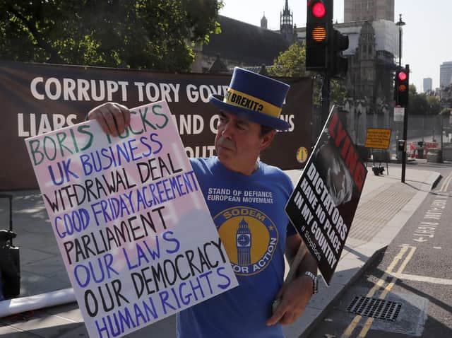 A pro EU protester stands near Parliament in London. Picture: AP Photo/Frank Augstein