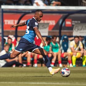 Hibs have signed left-back Jordan Obita from Wycombe Wanderers.