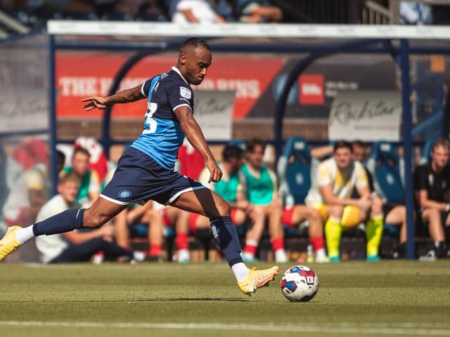 Hibs have signed left-back Jordan Obita from Wycombe Wanderers.