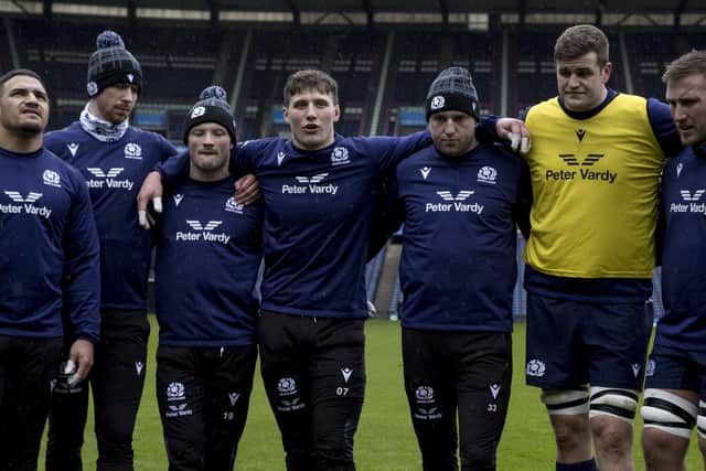 Scotland co-captains Rory Darge, centre, and Finn Russell, on his left, lead the team huddle during the final training session before the Six Nations match against France at Scottish Gas Murrayfield. (Photo by Craig Williamson / SNS Group)