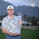 Amateur Nick Dunlap shows off the trophy after winning The American Express at Pete Dye Stadium Course in La Quinta, California. Picture: Orlando Ramirez/Getty Images.