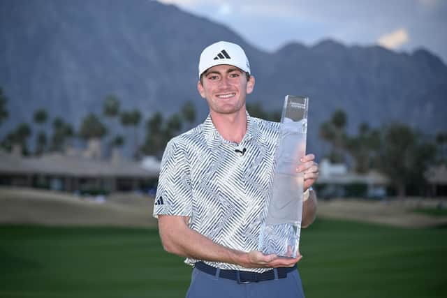 Amateur Nick Dunlap shows off the trophy after winning The American Express at Pete Dye Stadium Course in La Quinta, California. Picture: Orlando Ramirez/Getty Images.