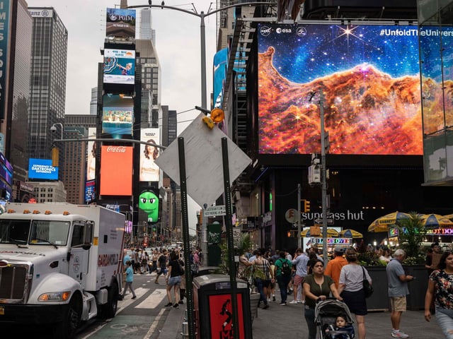 The images were also displayed on screens at Times Square in New York.