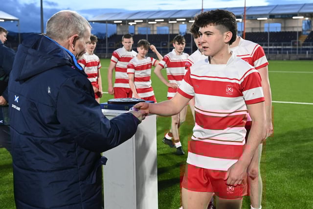 Loretto players receive their medals after winning the Shield final