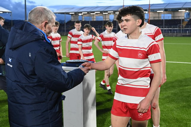 Loretto players receive their medals after winning the Shield final