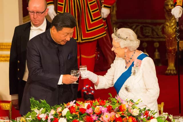 Chinese President Xi Jinping meets Queen Elizabeth at a state banquet in Buckingham Palace in 2015 (Picture: Dominic Lipinski/PA Wire)