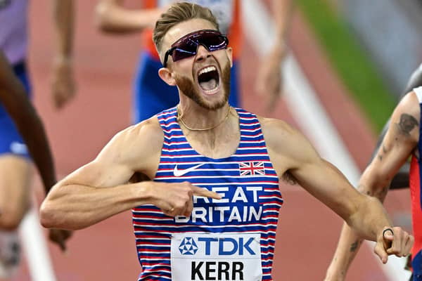 Josh Kerr celebrates after winning the men's 1500m final during the World Athletics Championships in Budapest. (Photo by ATTILA KISBENEDEK/AFP via Getty Images)
