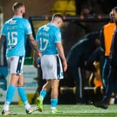 Dundee players look dejected as they head for the tunnel at full time at Livingston.