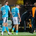 Dundee players look dejected as they head for the tunnel at full time at Livingston.