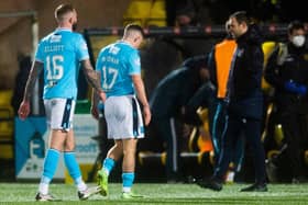 Dundee players look dejected as they head for the tunnel at full time at Livingston.