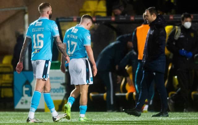 Dundee players look dejected as they head for the tunnel at full time at Livingston.