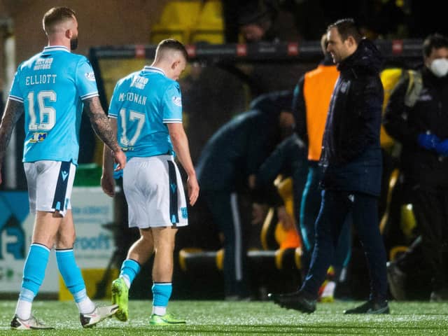 Dundee players look dejected as they head for the tunnel at full time at Livingston.