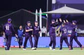 Scotland's players celebrate after the dismissal of Oman's captain Zeeshan Maqsood.