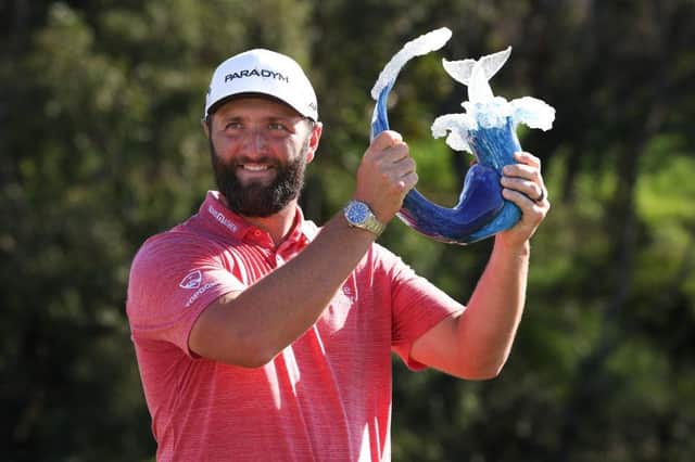 Jon Rahm celebrates with the trophy after winning the Sentry Tournament of Champions at Plantation Course at Kapalua Golf Club in Lahaina, Hawaii. Picture: Harry How/Getty Images.