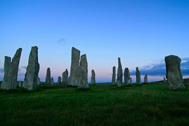 The Calanais Standing Stones overlook the stunning Loch Roag above the village of Calanais on the Isle of Lewis (Outer Hebrides). Historic Environment Scotland reports that the stones “were erected between 2900 and 2600 BC – before the main circle at Stonehenge in England.”