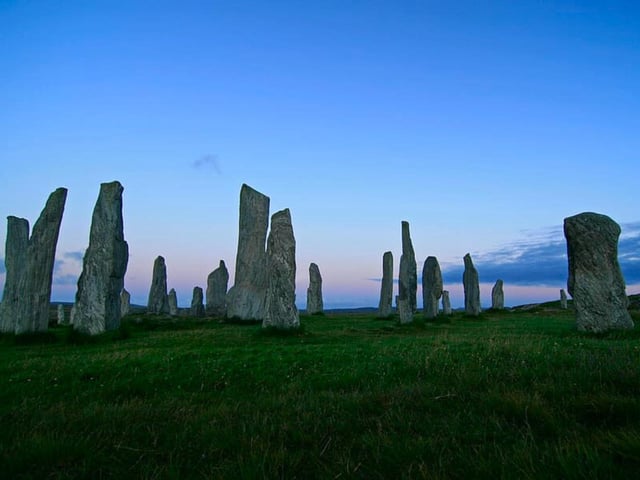 The Calanais Standing Stones overlook the stunning Loch Roag above the village of Calanais on the Isle of Lewis (Outer Hebrides). Historic Environment Scotland reports that the stones “were erected between 2900 and 2600 BC – before the main circle at Stonehenge in England.”