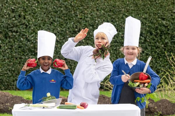 Schoolchildren from Forthview Primary celebrate the launch of the Edinburgh International Children’s Festival at the Royal Botanic Gardens with artist Suzi Cunningham ahead of the performance of ‘Soup,’ which will be part of the event's opening day celebration at the National Museum of Scotland. Picture: Julie Howden
