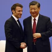 French President Emmanuel Macron, left, and Chinese President Xi Jinping take part in a Franco-Chinese business council meeting in Beijing. Picture: Ludovic Marin/Pool via AP