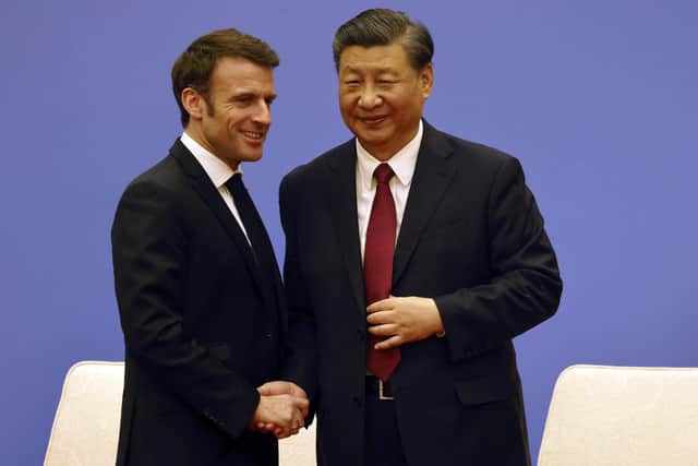 French President Emmanuel Macron, left, and Chinese President Xi Jinping take part in a Franco-Chinese business council meeting in Beijing. Picture: Ludovic Marin/Pool via AP
