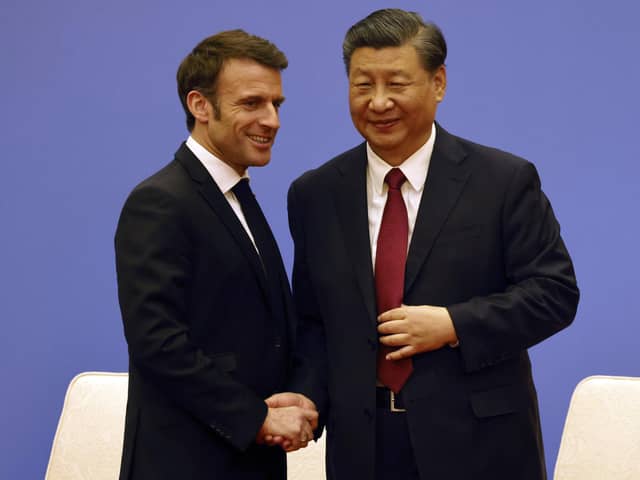 French President Emmanuel Macron, left, and Chinese President Xi Jinping take part in a Franco-Chinese business council meeting in Beijing. Picture: Ludovic Marin/Pool via AP
