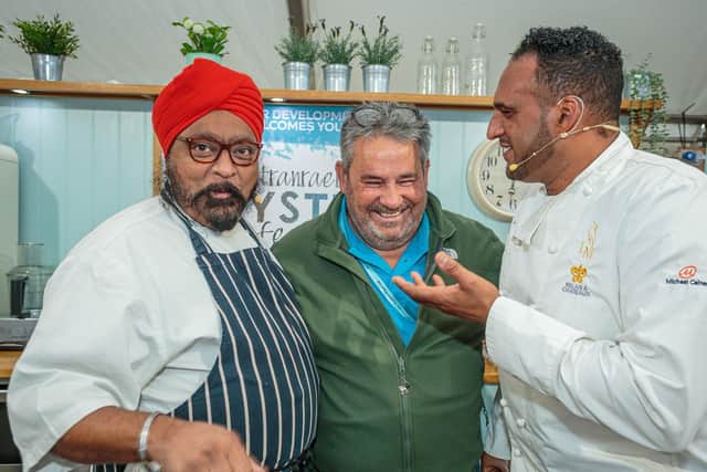 Guest chefs Tony Singh, left, and Michael Caines, right, with Romano Petrucci from Stranraer Development Trust at last year's festival. PIC: Peter Robinson