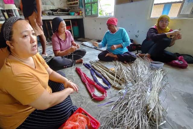 Hanim Apeng, from the Temuan -Jah Hut tribe in Malaysia, leads a team of indigenous women creating woven artworks symbolising the plight of living on the frontline of climate change