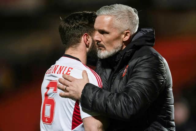 Dundee United manager Jim Goodwin and Aberdeen's Graeme Shinnie embrace after the match at Tannadice.