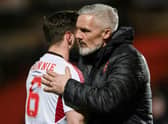Dundee United manager Jim Goodwin and Aberdeen's Graeme Shinnie embrace after the match at Tannadice.