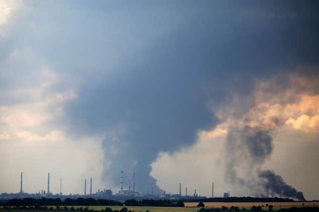 Smoke billows  over the oil refinery outside the town of Lysychansk on June 23, 2022,  amid Russia's military invasion launched on Ukraine. (Photo by Anatolii Stepanov via Getty Images)