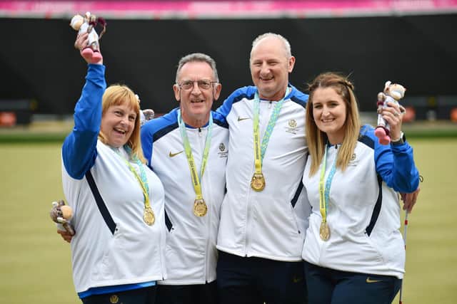Gold medalists Melanie Innes, George Miller, Robert Barr and Sarah Jane Ewing of Team Scotland celebrate their victory in the Para Mixed Pairs B2/B3. (Photo by Nathan Stirk/Getty Images)
