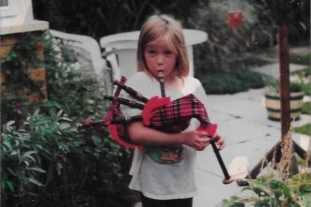 Hollie McNish having a shot on the bagpipes as a child. Pic: Hollie McNish