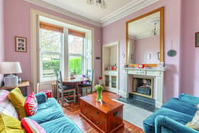 Plenty of period features enhance the flat’s bright living room