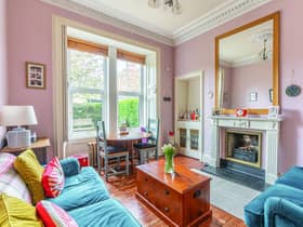 Plenty of period features enhance the flat’s bright living room