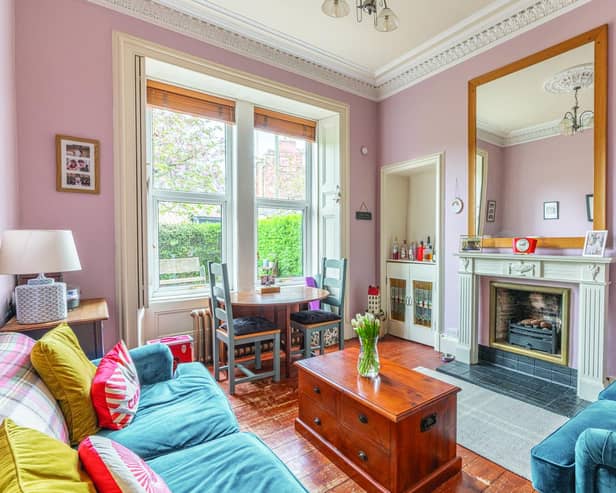 Plenty of period features enhance the flat’s bright living room