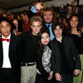 Jack Black (back) with the child cast members (L-R) Robert Tsei, Kevin Clark, Miranda Cosgrove, Joey Gaydos, and Rivkah Reyes attend the gala screening for 'School of Rock' during the 2003 Toronto International Film Festival (Photo: Donald Weber/Getty Images)