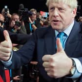 Boris Johnson acknowledges the applause from his Cabinet after delivering his speech at the annual Conservative Party conference (Picture: Stefan Rousseau/pool/AFP via Getty Images)