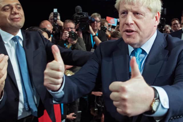 Boris Johnson acknowledges the applause from his Cabinet after delivering his speech at the annual Conservative Party conference (Picture: Stefan Rousseau/pool/AFP via Getty Images)