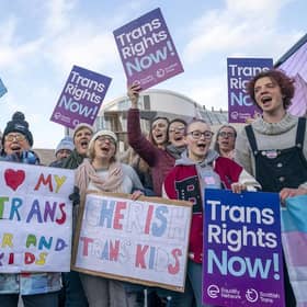 Supporters of the Gender Recognition Reform Bill (Scotland) take part in a protest outside the Scottish Parliament, Edinburgh, ahead of a debate on the bill