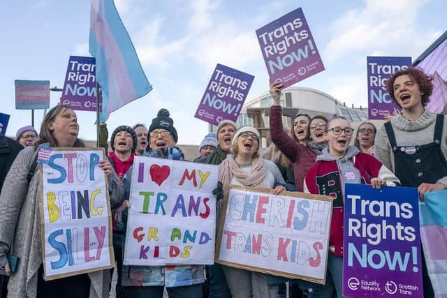 Supporters of the Gender Recognition Reform Bill (Scotland) take part in a protest outside the Scottish Parliament, Edinburgh, ahead of a debate on the bill