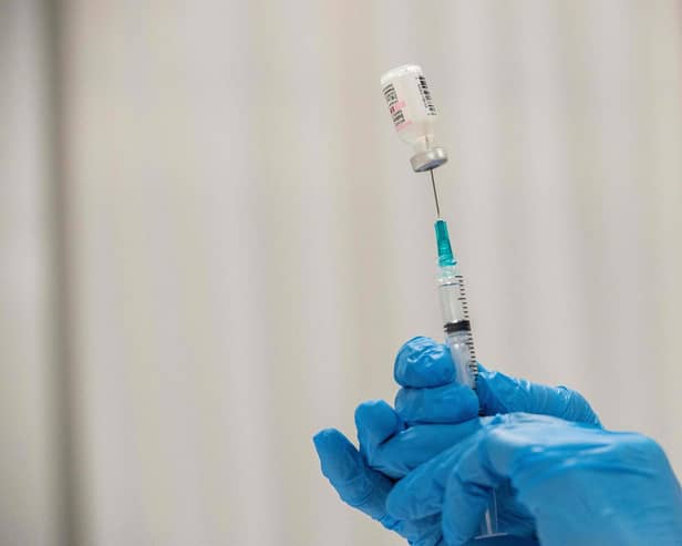 Pharmacist Kathie McDonough reconstitutes the Pfizer-BioNTech Covid-19 vaccine as she fills syringes Worcester, Massachusetts, April 2021. PIC: by Joseph Prezioso / AFP via Getty Images
