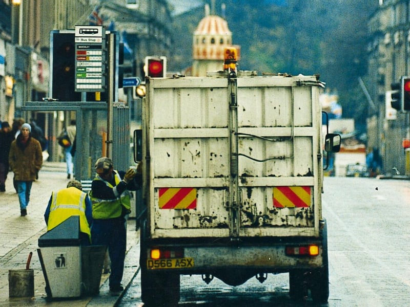 Cleansing department road cleaners clearing up Princes Street after the 1995 Hogmanay celebrations.