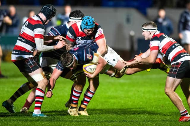 Watsonians Ben Muncaster is taken down by Stirling County players.
