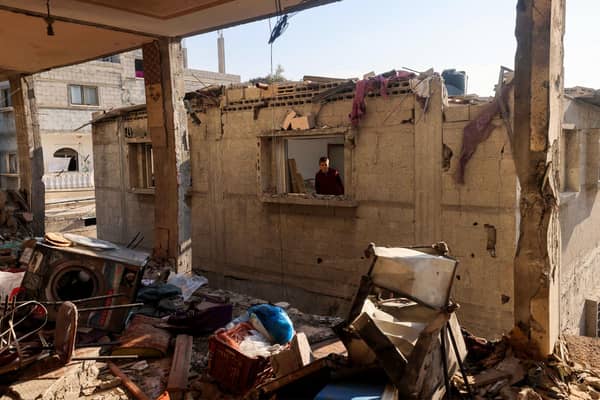 A child looks through the window of a destroyed house following Israeli bombardment in Rafah, on the southern Gaza Strip, amid continuing battles between Israel and the Palestinian militant group Hamas. Picture: AFP via Getty Images