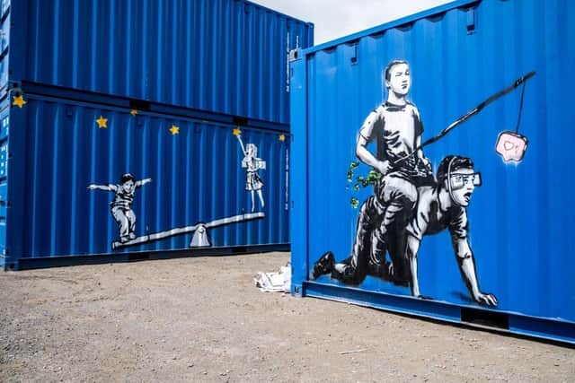 The Rebel Bear works on industrial containers